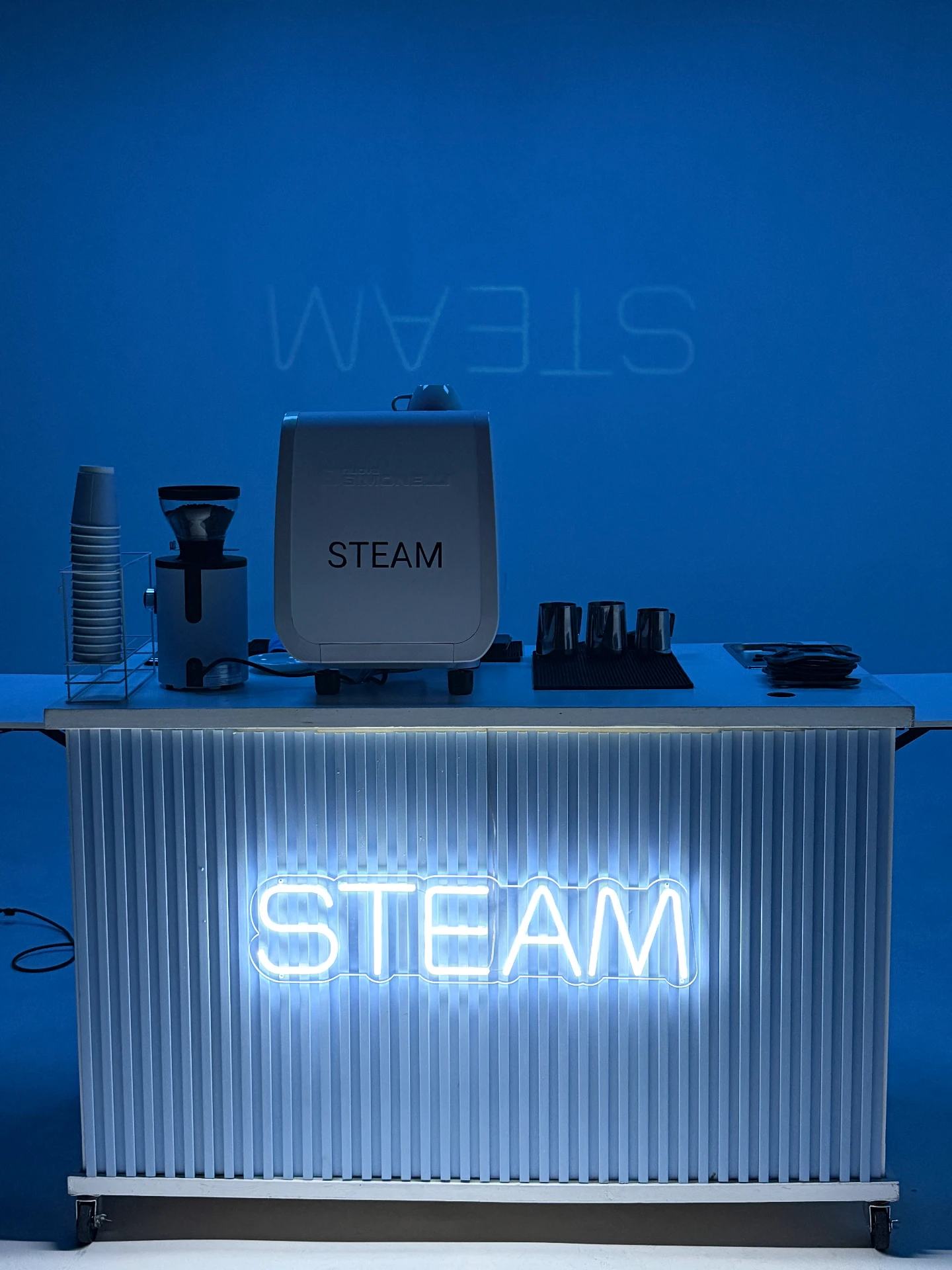 STEAM mobile café under blue event lighting
