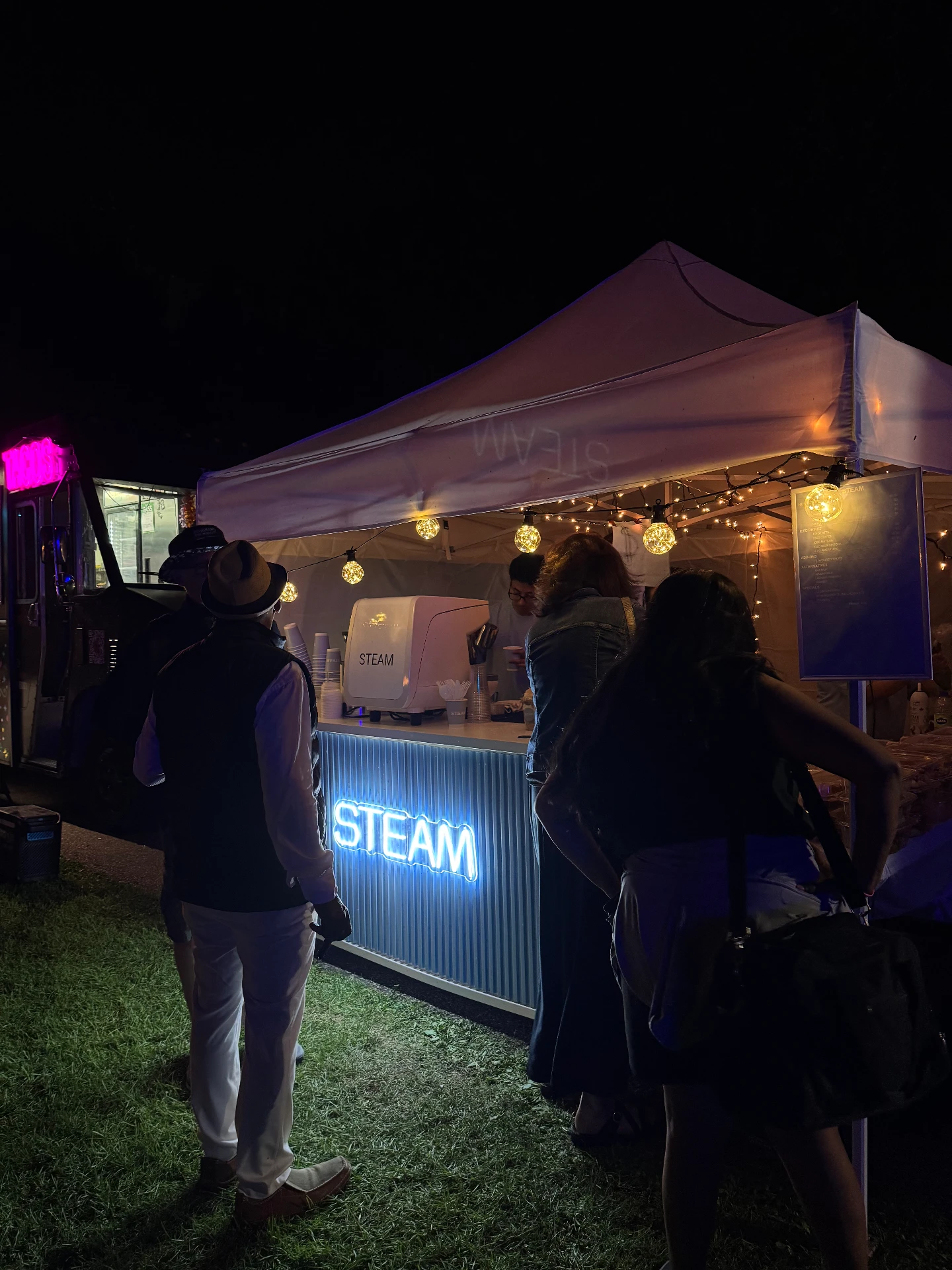 Guests gathered at the STEAM Coffee Co. cart during an evening event
